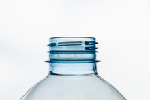 Transparent Plastic Bottles, On A Clear Surface. Transparent Bottle Neck. Recycling And Disposal Of Single-use Plastics. 
