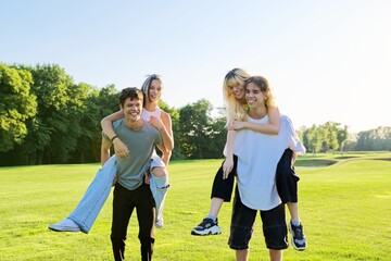 Wall Mural - Happy group of teenagers having fun outdoors