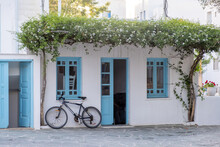 Greece, Cyclades. Folegandros Island,Whitewashed Wall With Flowering Jasmine