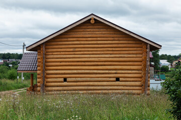 Log house in the village. Close-up.