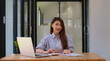 © itchaznong - Fund managers researching and analysis Investment stock market by paperwork on wooden desk in office