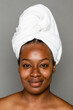 © McKinsey Jordan/Stocksy - Naturally Beautiful Black Woman With Hair In A Towel