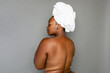 © McKinsey Jordan/Stocksy - Topless Black Woman With Bath Towel On Her Head