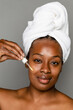 © McKinsey Jordan/Stocksy - Black Woman Applying Her Skincare Routine