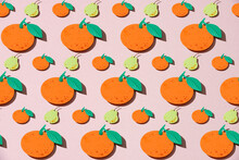 Abstract Seamless Pattern With Oranges, Pears And Green Leafs Isolated On Pink Background.