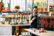 © Inuk Studio/Stocksy - Cheerful craftswoman with smartphone in woodwork workshop
