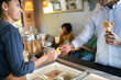 © PER Images/Stocksy - Cafe payment