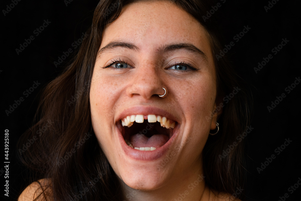 close up of a beautiful woman smiling with diastema