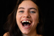 © Felix Chacon/Stocksy - close up of a beautiful woman smiling with diastema