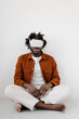 © Alina Hvostikova/Stocksy - Content black man meditating in VR glasses