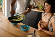© Valentina Barreto/Stocksy - Boyfriend serving food to his girlfriend