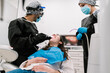 © Ezequiel Giménez/Stocksy - Dentists checking oral cavity with tool