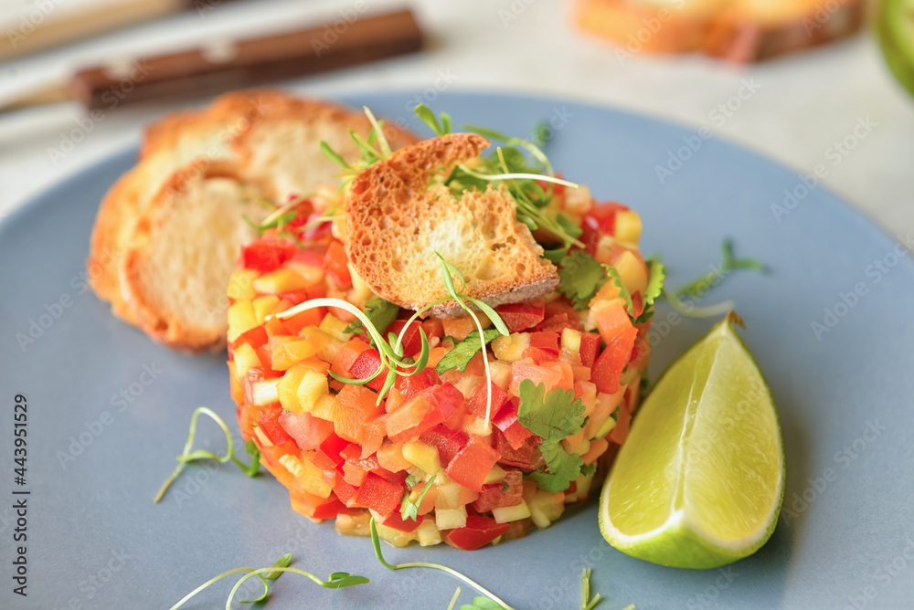 Plate with tasty tartare salad, closeup
