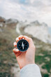 © Alex Photo - Woman hiker with a compass in her hands and a beautiful manicure in the background walking trail.