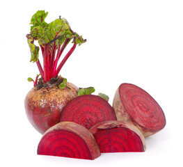 Wall Mural - Isolated beetroot. One fresh red beet with leaves and a half isolated on white background