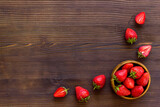 Fototapeta Tulipany - Strawberry flat lay - berries in bowl top view