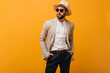 © Look! - Portrait of guy in sunglasses dressed in suit and hat