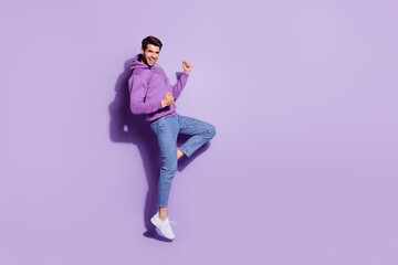 Full length body size view of attractive lucky cheerful guy jumping rejoicing great news isolated over purple violet color background