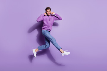 Poster - Full length body size photo man jumping up wearing hoody isolated pastel purple color background