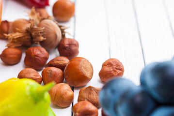 Wall Mural - autumn fruits and vegetables on white wooden