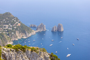 Wall Mural - Faraglioni, attractive coastal rock formation eroded by waves, Capri, Italy