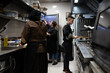 © Luis Velasco/Stocksy - Workers In The Kitchen Of A Restaurant.