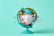 © Yaroslav Danylchenko/Stocksy - Globe with green moss, flowers and protective medical mask