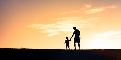 Father and son holding hands. Fatherhood and parent child relationships.  