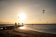 © Malquerida Studio/Stocksy - Anonymous man kitesurfing during sunset on the sea