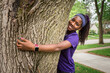 © Gabriel (Gabi) Bucataru/Stocksy - African American girl hugging a tree in her front yard