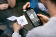 © Sean Locke/Stocksy - Dining: Customers Scanning Menu QR Code On Smart Phone