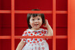 © Pansfun Images/Stocksy - Cute child portrait in red frame