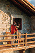 © David Prado/Stocksy - Loving couple kissing on rural house balcony in sunny nature