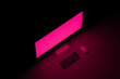© Marcos Osorio/Stocksy - Desktop computer with fuchsia screen turned on