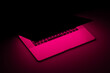 © Marcos Osorio/Stocksy - Laptop with fuchsia neon light illuminated screen ready to play