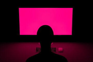 Gamer in front of computer with fuchsia screen
