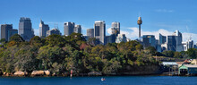 Panoramic View Of Sydney City Skyline With Royal Botanic Gardens In Foreground