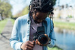 © Mattia/Stocksy - Balck Photographer with Vintage Camera