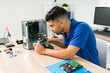 © AntonioDiaz - Focused technician checking the pc hardware
