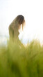 © JOE LORENZ DESIGN - Young happy pretty woman girl relax in high summer grass field at sunset
