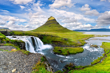 Wall Mural - landscape view of Kirkjufellsfoss In the daytime, blue sky and beautiful clouds. The waterfall is famous and a popular tourist spot in Iceland.