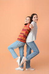 Poster - Cute twin girls on color background