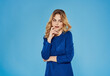 © SHOTPRIME STUDIO - emotional woman in blue dress studio blue background model