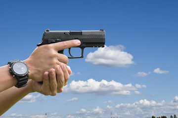 hand with gun