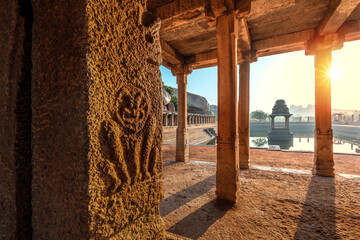 Wall Mural - View of sunrise at Pushkarni, Sri Krishna tank in ruins. Hampi, karnataka, India.