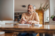 © bnenin - Adult man, attending a business meeting.