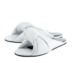 Beautiful pair of snow-white flip-flops made of genuine white leather with crisscrossing stripes, on a thin sole, isolated on a white background. The trend of the season.