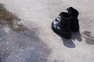 black boot safety on wet floor