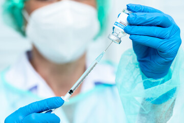 Doctor, woman nurse, scientist hand in white gloves holding bottle, syringe coronavirus, covid-19 vaccine disease preparing for a child, adult, man and woman vaccination shot medicine and drug concept