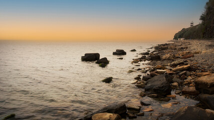 Wall Mural - Beautiful sea evening landscape for wallpaper design. Nature landscape. landscape with a rocky shore.